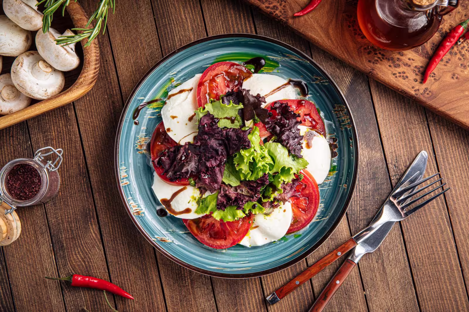 Gourmet tomato mozzarella Caprese salad with lettuce salad