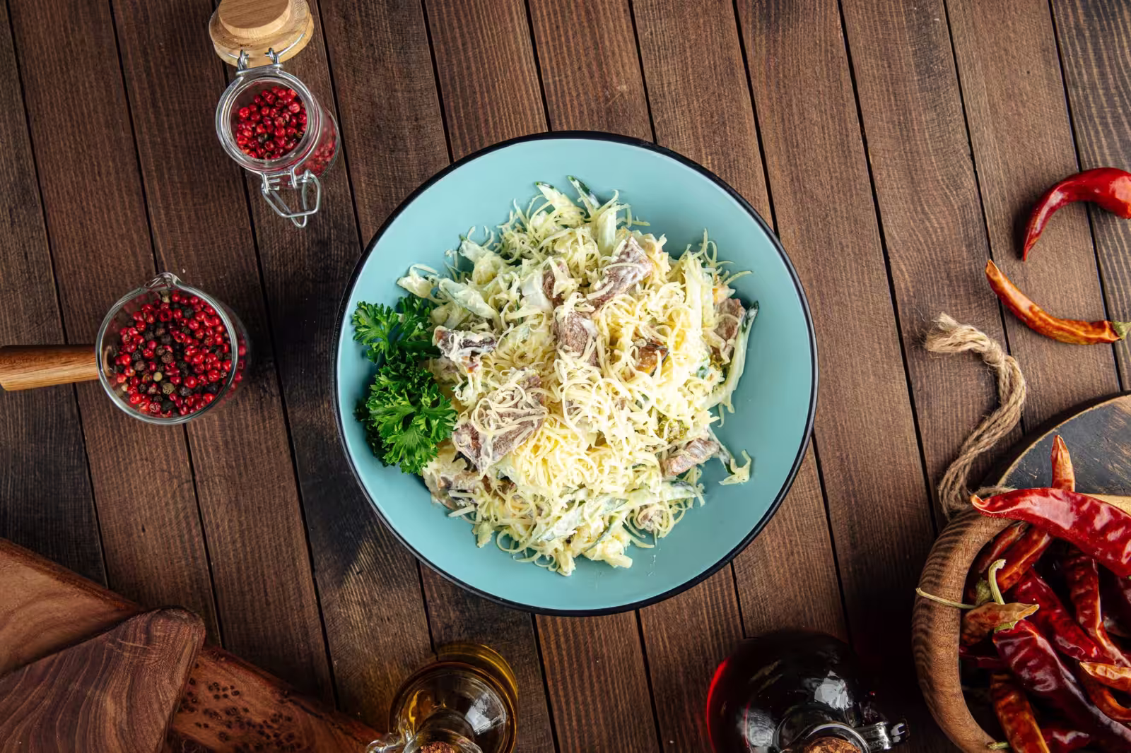 A bowl of chicken potato salad with a creamy mayonnaise dressing