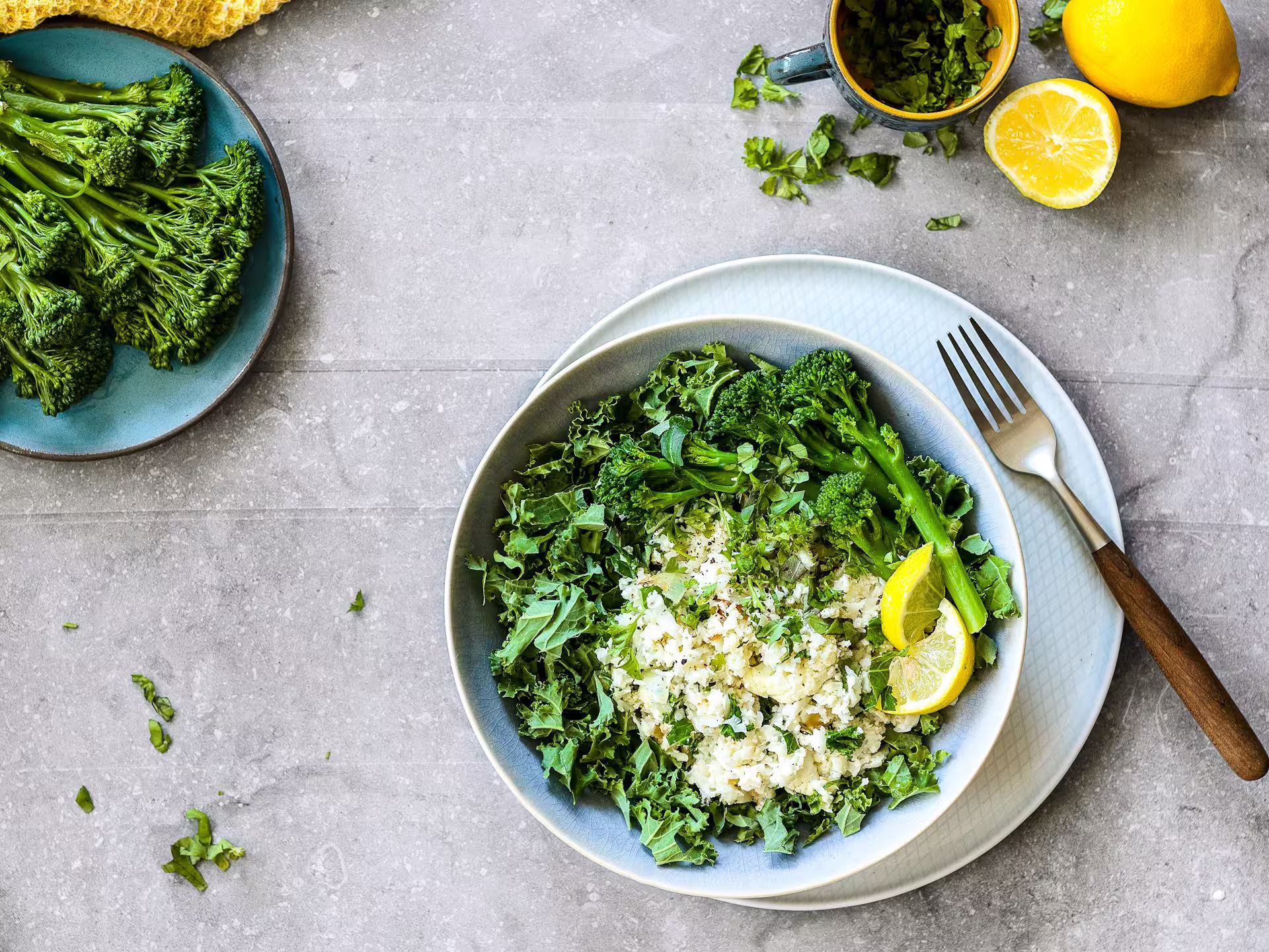 Bowl of creamy lemon risotto with barley, spinach, and broccoli